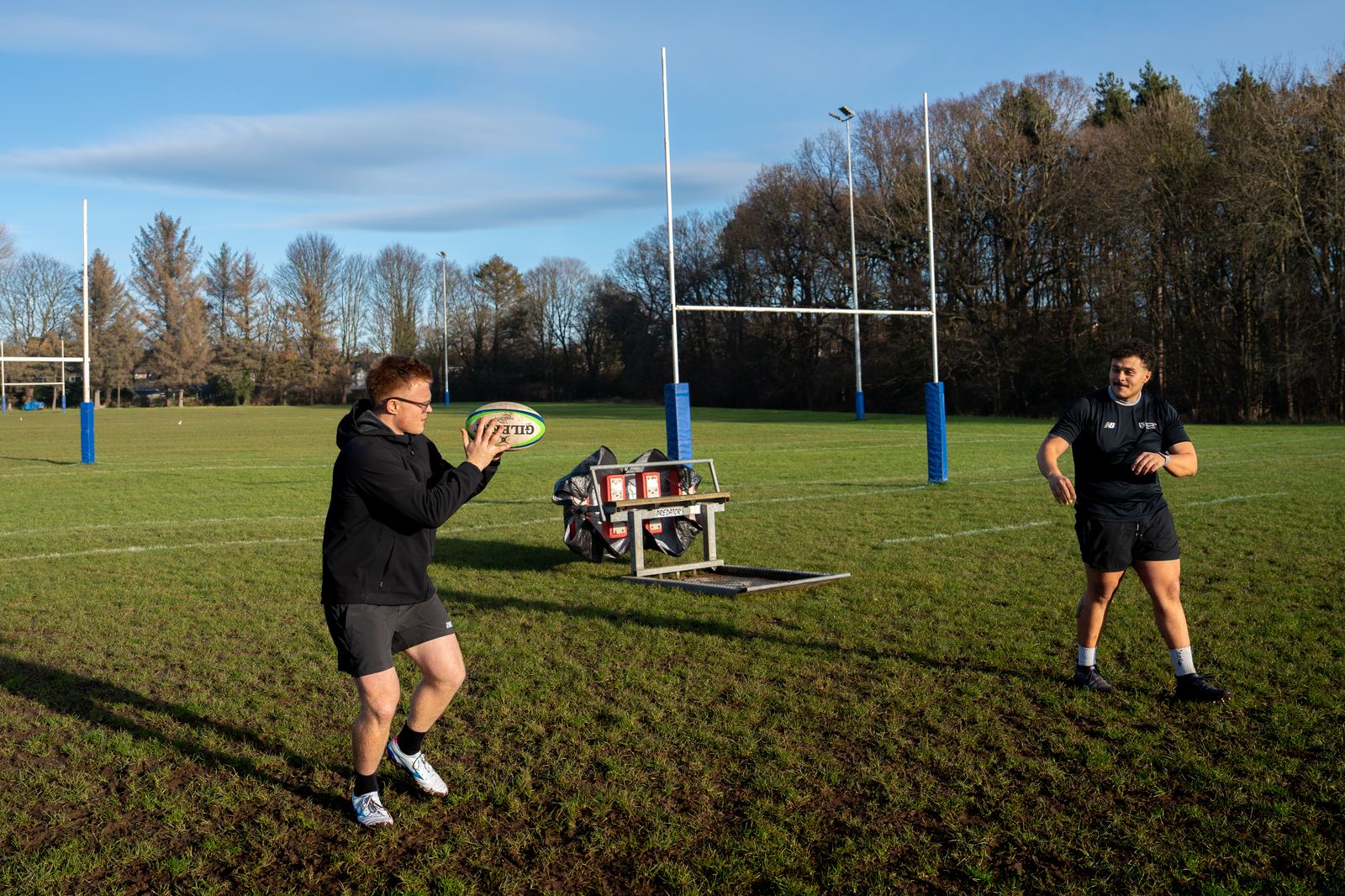 Group online coaching session on the rugby pitch